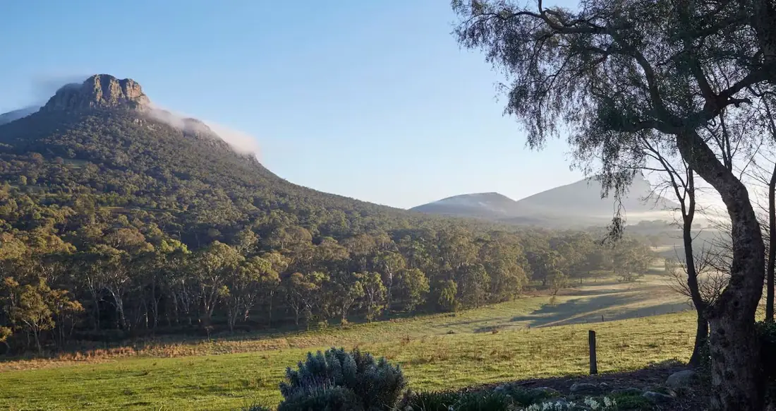 Morning mist lying in the paddocks below Mount Sturgeon